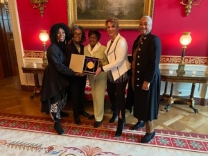 The five founders of IABD pose with their medal of the arts in the White House