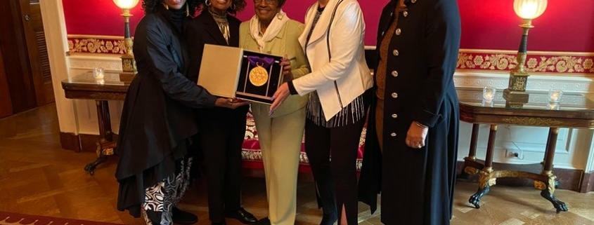 The five founders of IABD pose with their medal of the arts in the White House