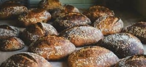 A close up of rows of crusty loaves of bread at Raleigh Street Bakery