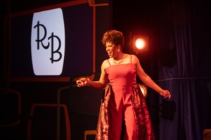 Sheryl McCallum poses onstage as she sings in Miss Rhythm - The Legend of Ruth Brown