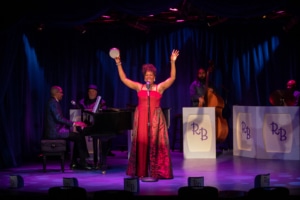 Sheryl McCallum poses as she sings onstage in Miss Rhythm - The Legend of Ruth Brown