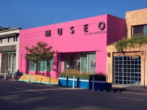 The bright pink exterior of Museo de las Americas