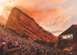 Thousands of people sit at Red Rocks