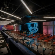 The main listening room at Dazzle's new location. Many red chairs circle a small stage for a jazz band.