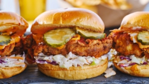 Three Nashville hot chicken sandwiches lined up for their beauty shot
