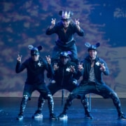 Dancers dressed as mice form a pyramid