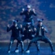 Dancers dressed as mice form a pyramid