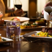 A table filled with brunch delights and cocktails.