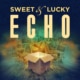 A dark blue background with an open cardboard box in the foreground, which is emitting light. The box is surrounded by photographs depicting sepia-toned images. The text "Sweet & Lucky Echo" appears in yellow.