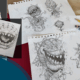 Various illustrations that show the design process of creating the icon for Little Shop of Horrors