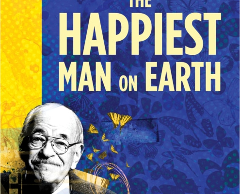 The title treatment in blue spelling "The Happiest Man on Earth" on top of a yellow background with birds and a barb wire fence in the background.