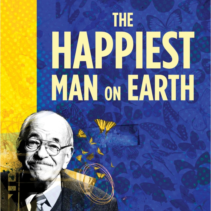 The title treatment in blue spelling "The Happiest Man on Earth" on top of a yellow background with birds and a barb wire fence in the background.
