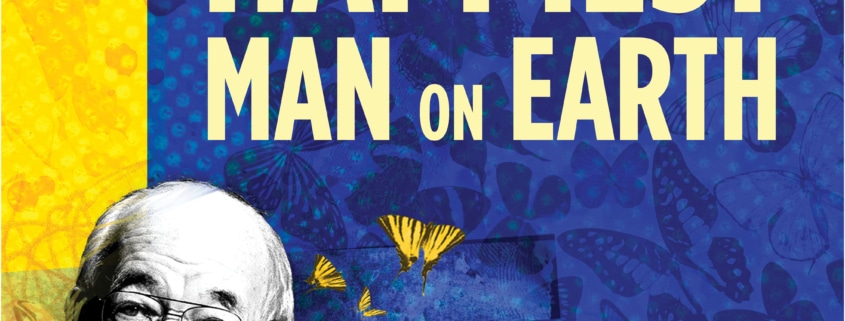 The title treatment in blue spelling "The Happiest Man on Earth" on top of a yellow background with birds and a barb wire fence in the background.