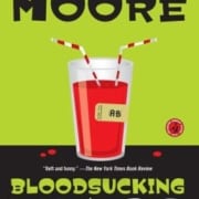 ook cover of Bloodsucking Fiends by Christopher Moore, featuring a glass of red liquid with two straws and a label reading 'AB'.