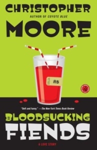 ook cover of Bloodsucking Fiends by Christopher Moore, featuring a glass of red liquid with two straws and a label reading 'AB'.