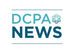 An image in various shades of teal that says DCPA News and includes the circular logo of the Denver Center for the Performing Arts