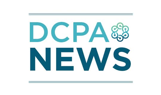 An image in various shades of teal that says DCPA News and includes the circular logo of the Denver Center for the Performing Arts