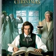DVD cover of 'The Man Who Invented Christmas' featuring Dan Stevens, Christopher Plummer, and Jonathan Pryce. The central character is writing at a desk with ghostly figures behind him