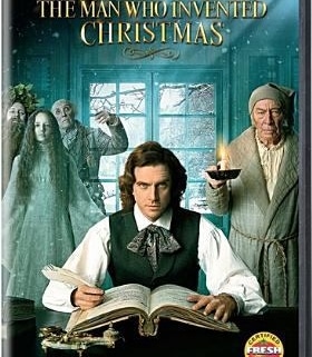 DVD cover of 'The Man Who Invented Christmas' featuring Dan Stevens, Christopher Plummer, and Jonathan Pryce. The central character is writing at a desk with ghostly figures behind him