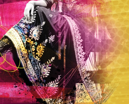 Close-up of a person’s crossed legs wearing a richly embroidered garment with floral patterns in white, blue, and yellow, set against a vibrant pink and yellow abstract background.