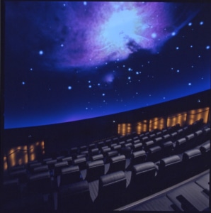 Theatre seating with large screen depicting images of outer space