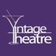 A logo for the Vintage Theatre with a purple background and their name in all white. The "V" and "T" are made out of a martini glass illustration