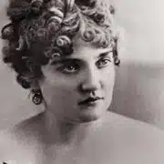 A black and white image of Elizabeth McCourt (otherwise known as Baby Doe Tabor) with bared shoulders and curly hair atop her hear.
