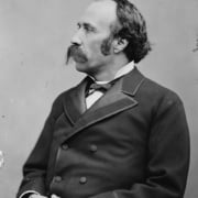 A black and white portrait of Horace Tabor in profile with a handlebar mustache, receding hairline, and 1800s suit.
