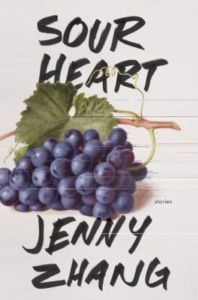 The dust jacket for the book, Sour Heart, and the author's name, Jenny Zhang, on a white background with the image of a bunch of blueberries clipped from a vine with a green leaf.