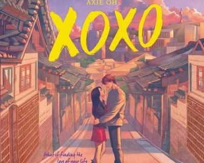 Illustrated cover for XOXO showing a couple embracing and kissing in the middle of a quiet street lined with traditional Korean buildings at sunset.