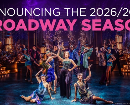 Colorful theatrical cast performing a lively dance number on a grand, art‑deco–inspired stage, with bold text above reading ‘Announcing the 2026/2027 Broadway Season.’ Bright costumes, dramatic lighting, and ornate set pieces create an energetic Broadway atmosphere.