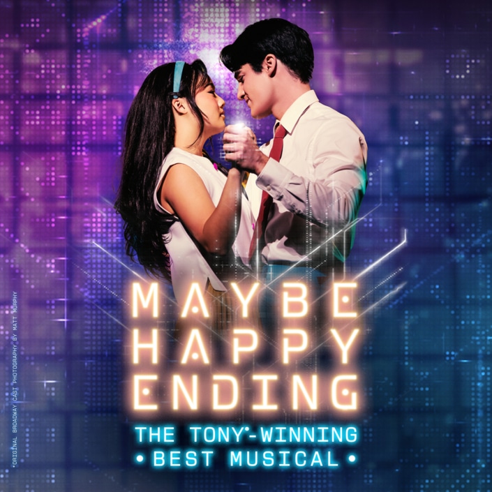 A graphic showing two people dancing closely in front of a vibrant, futuristic backdrop of neon lights and digital patterns. Neon letters read Maybe Happy Ending: The Tony-Winning Best Musical