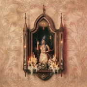 Ornate artwork showing a central framed niche with a crowned, seated figure surrounded by lit candles, set against a decorative beige patterned background.