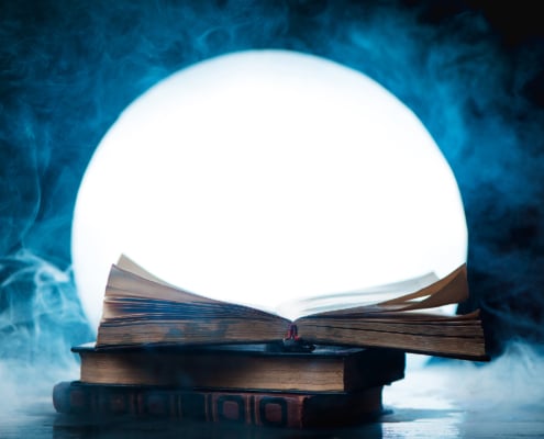 An open book of spells in full Moon. Reader imagination and writing inspiration concept with copy space