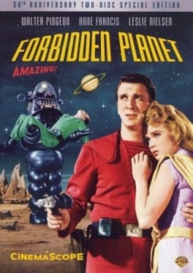 Movie poster for Forbidden Planet. A person in a bright red futuristic uniform stands in the foreground holding a ray gun while another person in a light-colored outfit stands beside them. Behind them, a large robot carries an unconscious figure across a rocky alien landscape. A ringed planet appears in the night sky above, with the film title displayed in bold yellow and red text.