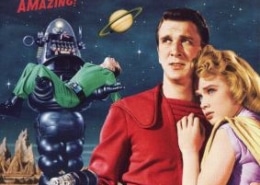 Movie poster for Forbidden Planet. A person in a bright red futuristic uniform stands in the foreground holding a ray gun while another person in a light-colored outfit stands beside them. Behind them, a large robot carries an unconscious figure across a rocky alien landscape. A ringed planet appears in the night sky above, with the film title displayed in bold yellow and red text.