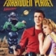 Movie poster for Forbidden Planet. A person in a bright red futuristic uniform stands in the foreground holding a ray gun while another person in a light-colored outfit stands beside them. Behind them, a large robot carries an unconscious figure across a rocky alien landscape. A ringed planet appears in the night sky above, with the film title displayed in bold yellow and red text.