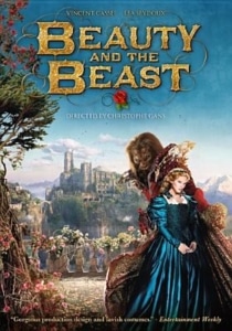Fantasy film poster for Beauty and the Beast showing two costumed characters in the foreground, with a castle, gardens, and distant landscape behind them. The title appears in ornate gold lettering at the top.